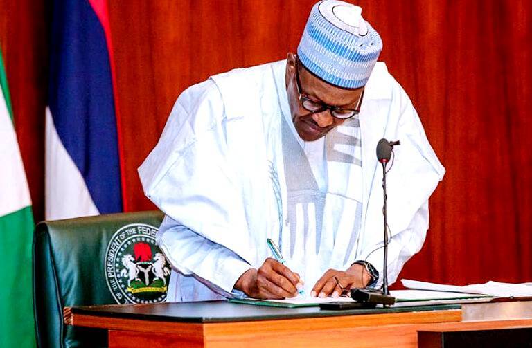 President Buhari signs 1 e1649242375632 768x503 1