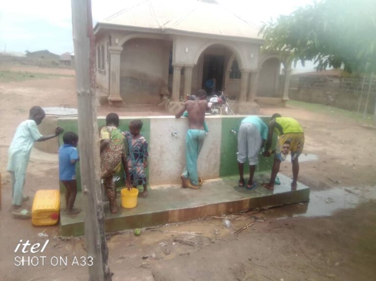 Children seen playing with the running water